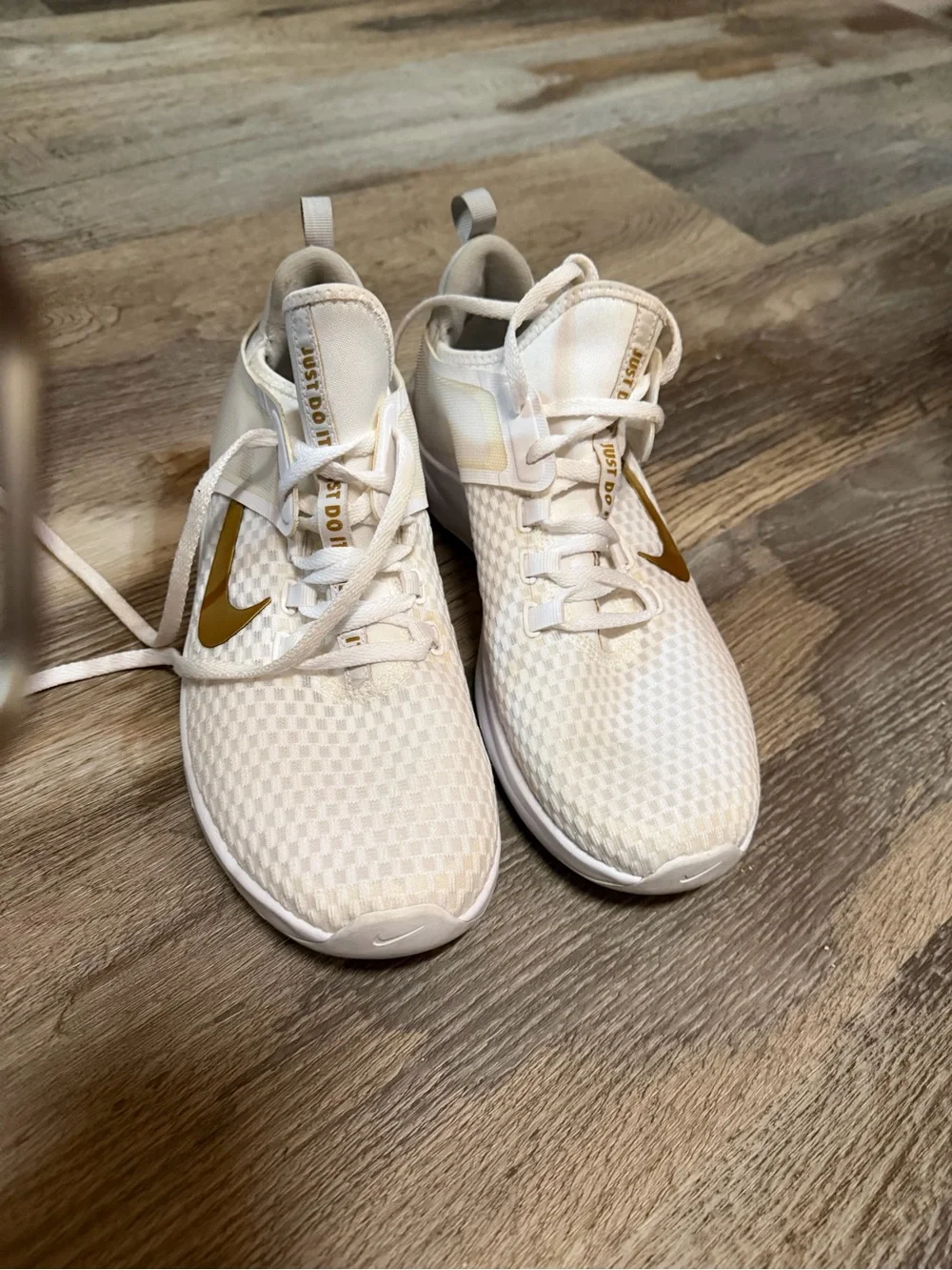 Nike Women's White Athletic Sneakers with Gold Swoosh